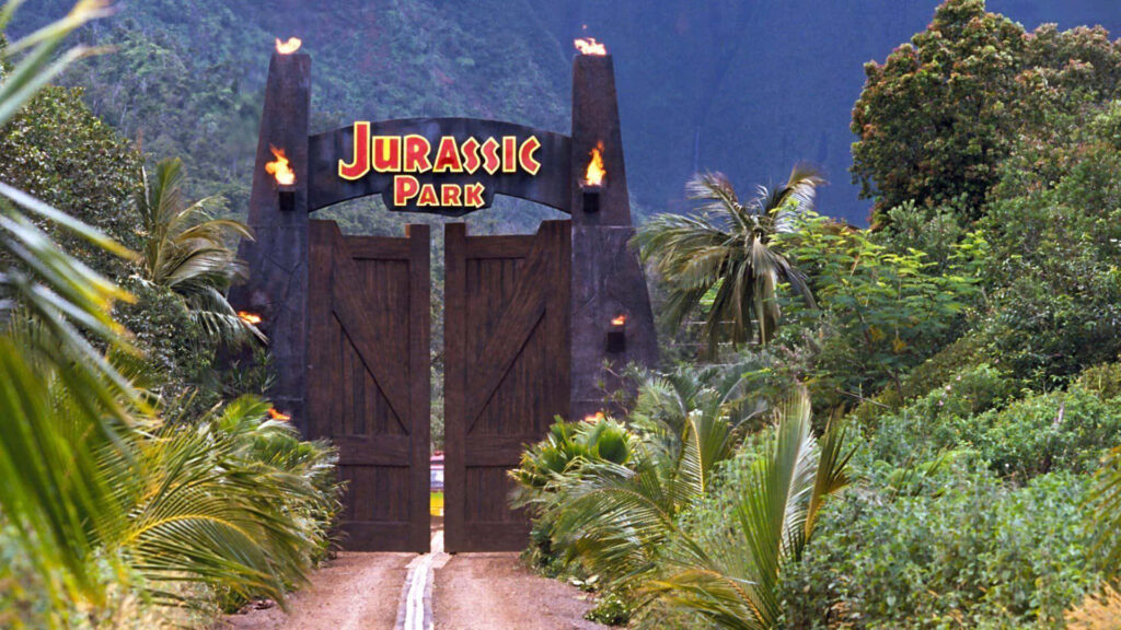 Jurassic Park Wallpaper: Iconic Gateway Amidst Lush Greenery