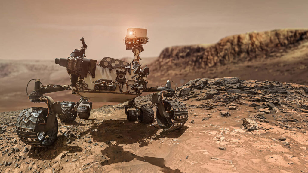 Exploring Mars: Rugged Terrain & Amber Sky Wallpaper Background
