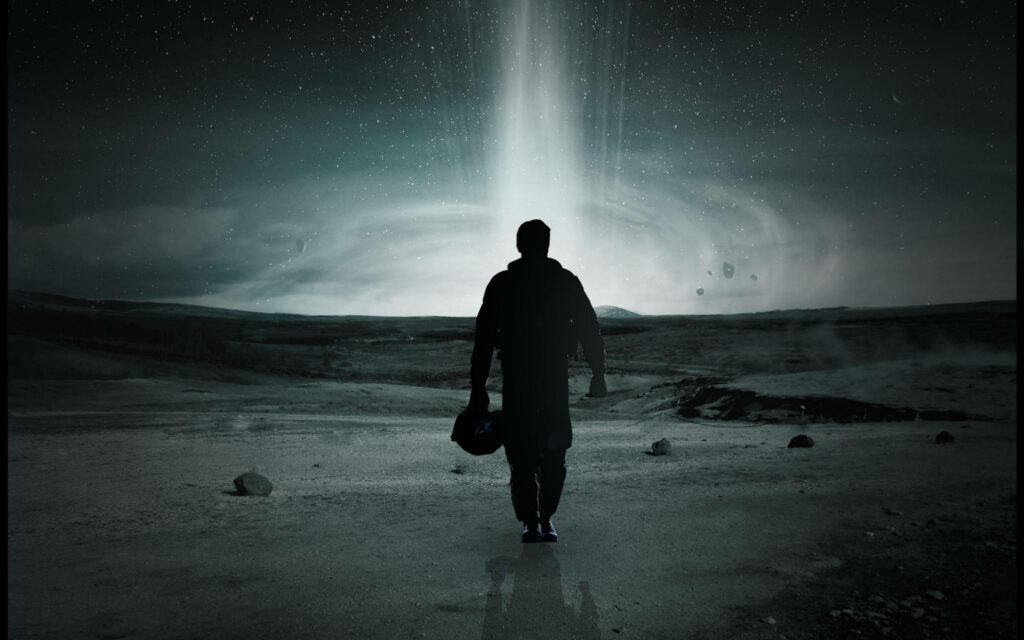 Silhouetted Astronaut in Interstellar: Journey Through the Darkness Wallpaper