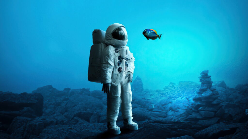 Galactic Voyager Plunging into Aquatic Depths: A Stellar Fusion of Astronaut and Artistry Wallpaper