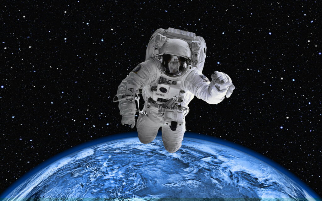 Glimpsing the Majestic Earth: A Mesmerizing Astronaut's View in HD Wallpaper