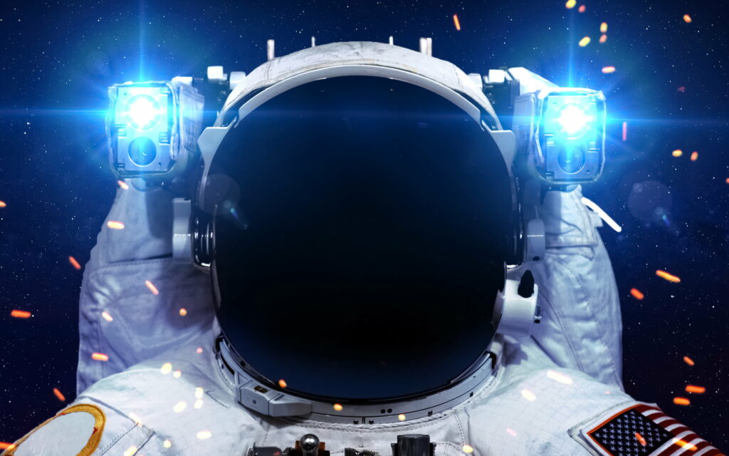 Exploring the Cosmos: A Majestic Astronaut Soaring through Infinite Galactic Horizons Wallpaper