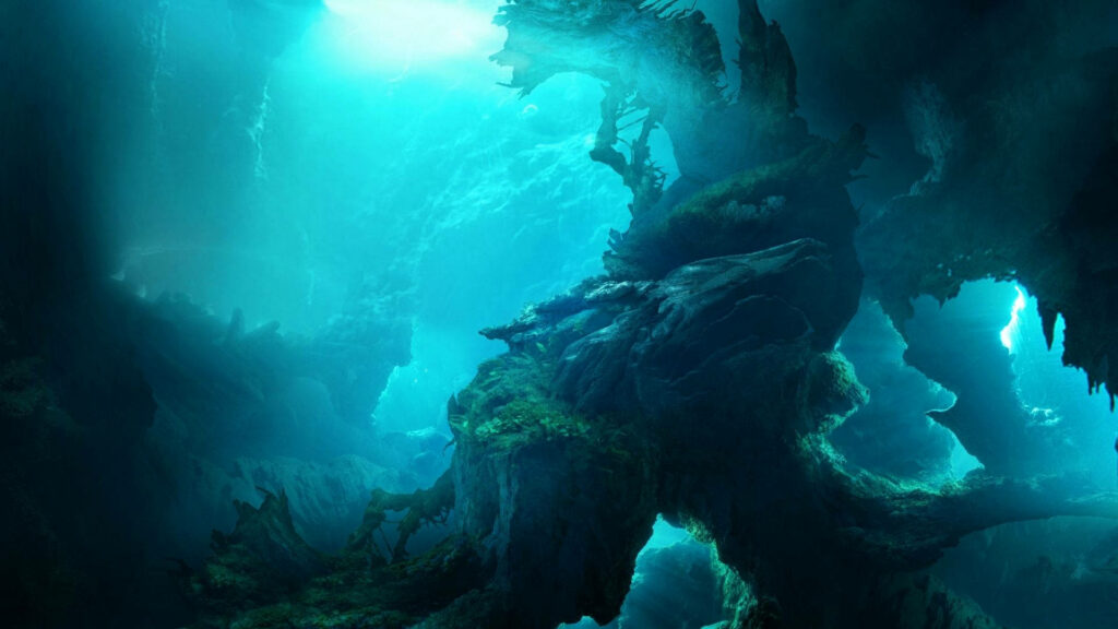 Mystical underwater cave wallpaper with glowing blue light over dramatic rock formations