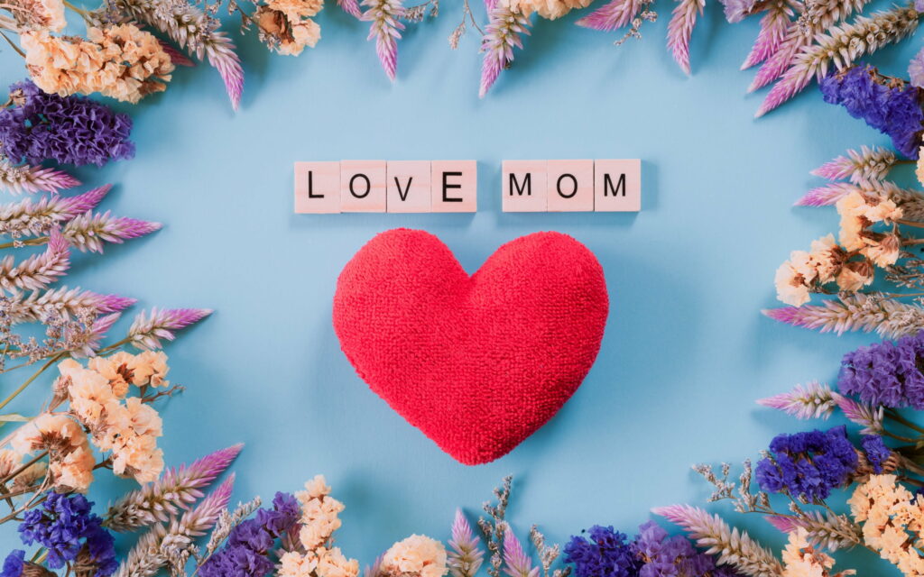 Expressing Eternal Devotion: A Radiant Red Heart Tribute to Mom - Captivating QHD Wallpaper Background