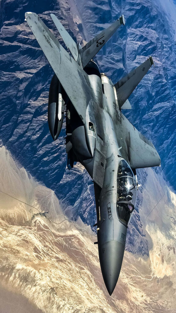 F-15 Eagle Soaring above Majestic Blue Mountain Terrain: A Captivating Jet Snapshot Wallpaper
