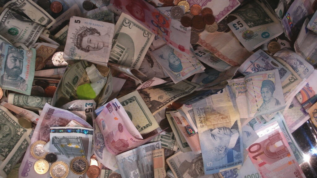 Global Currencies: A Diverse Tapestry of Money - Captivating HD Wallpaper