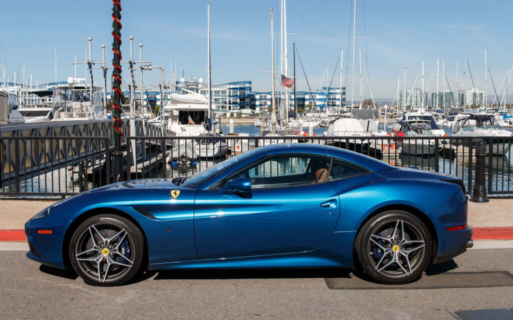 Ferrari California T Near a Dock Background Wallpaper