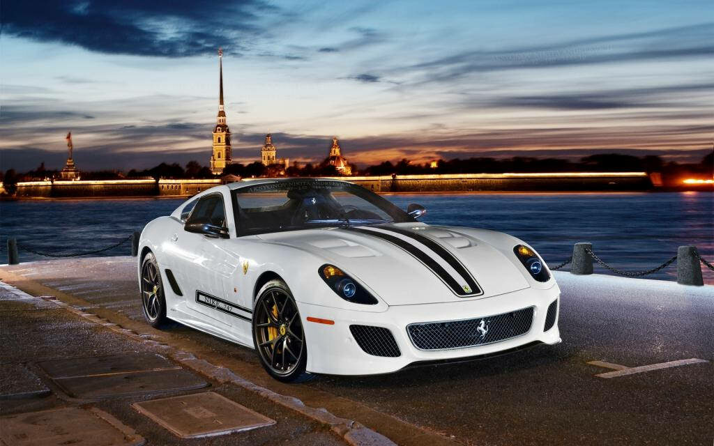 Exquisite White Ferrari Adorning a Stunning Dockside Backdrop - Serene Luxury Snapshot Wallpaper