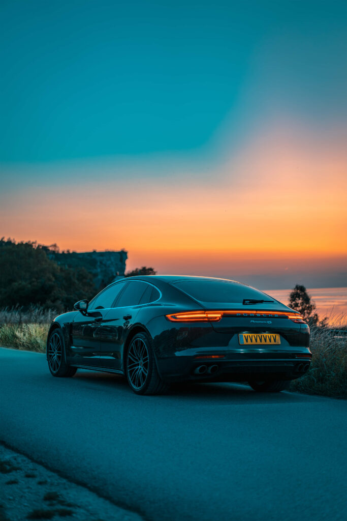 Roaming in Elegance: Captivating Porsche Panamera HD Wallpaper – A Luxurious Journey Amidst Luxury Brands