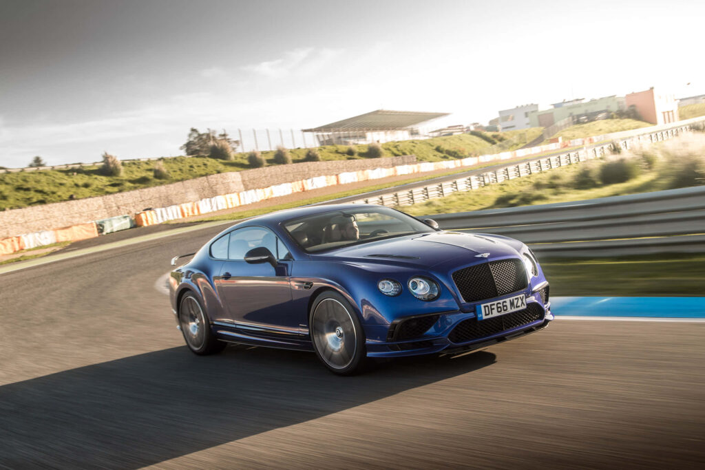 The Bentley Continental Supersports in a Captivating Backdrop Wallpaper