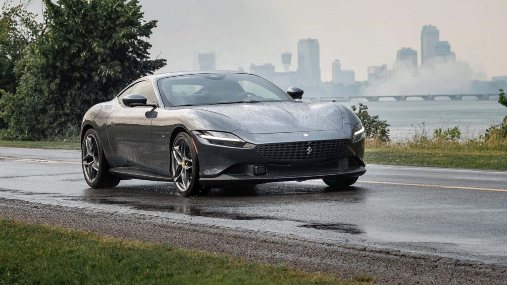 Captivating the Spirit of Elegance and Power: Marvel at the Dynamic Beauty of the Ferrari Roma on an Open Road Wallpaper