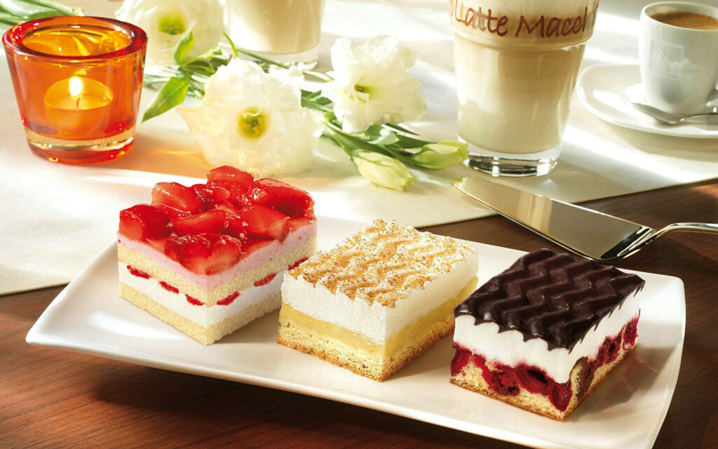 Fruity Pastry Desserts on a Table Background Wallpaper