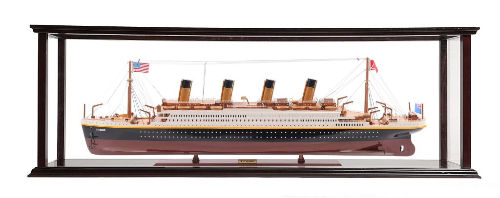 Detailed RMS Titanic scale model in wooden glass case with iconic funnels maritime history wallpaper