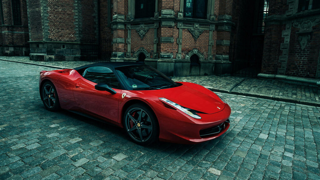 The Alluring Charm of a Pristine 2012 Rosso Corsa Ferrari 458 Italia: A Captivating Encounter on Urban Roads Wallpaper
