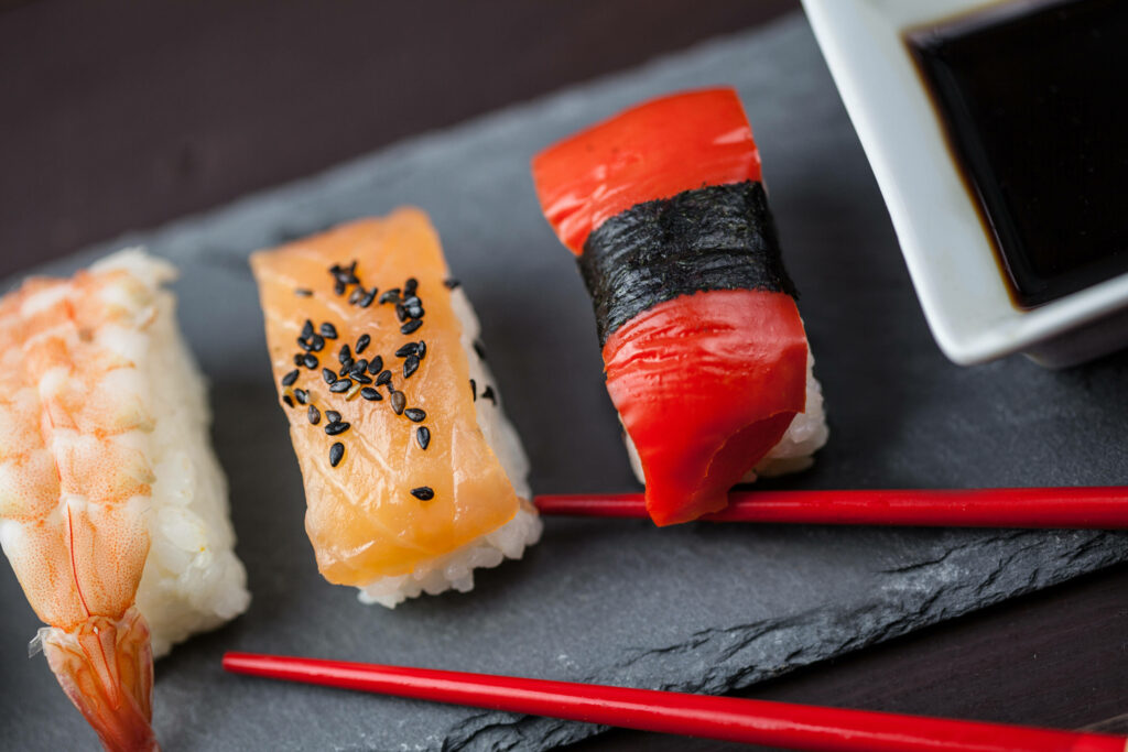 Delicious Sushi Wallpaper: Sashimi Shrimp, Tuna, and Salmon Delight