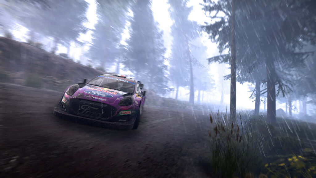 Intense dirt rally race car speeding through dusty forest trail with vibrant sponsor logos and atmospheric background Wallpaper