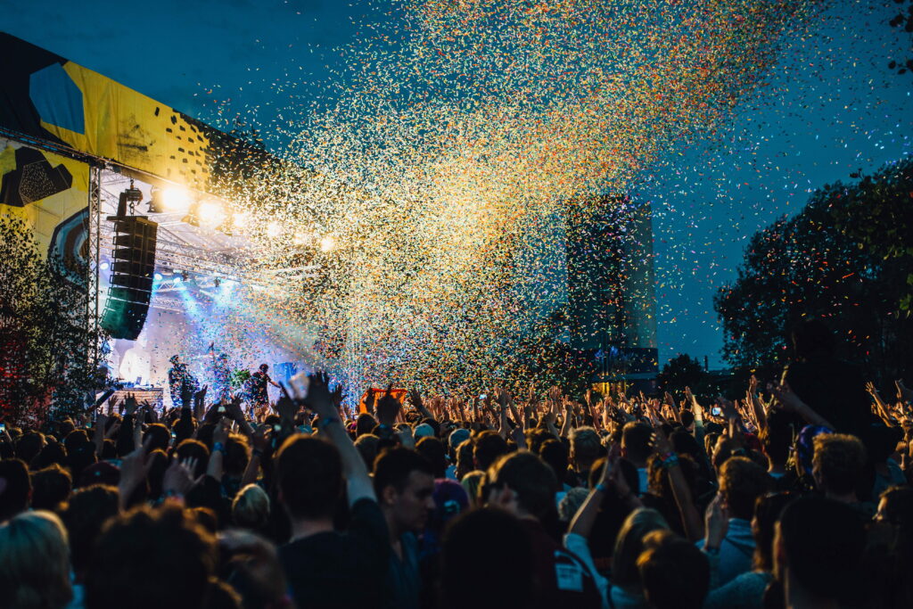 Exuberant Masses: A Vibrant Music Festival Affair, A Kaleidoscope of Joyful Celebrations Wallpaper