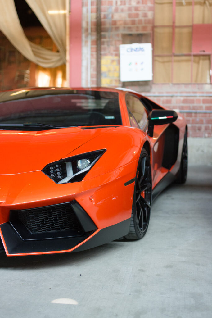 Stunning Orange Lamborghini Wallpaper: Industrial Background Design