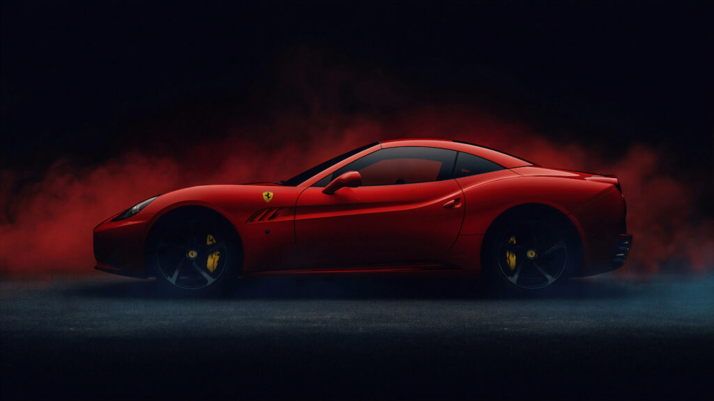 Captivating Red Ferrari California Takes Center Stage in Mysterious and Fiery Setting Wallpaper