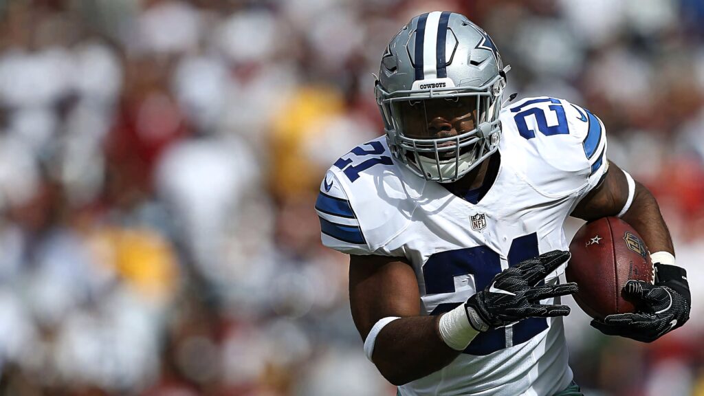 Ezekiel Elliott Dallas Cowboys running back action shot NFL uniform dynamic football wallpaper