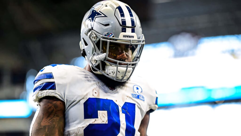 Ezekiel Elliott Dallas Cowboys wallpaper vibrant blue white tones intense game focus high resolution