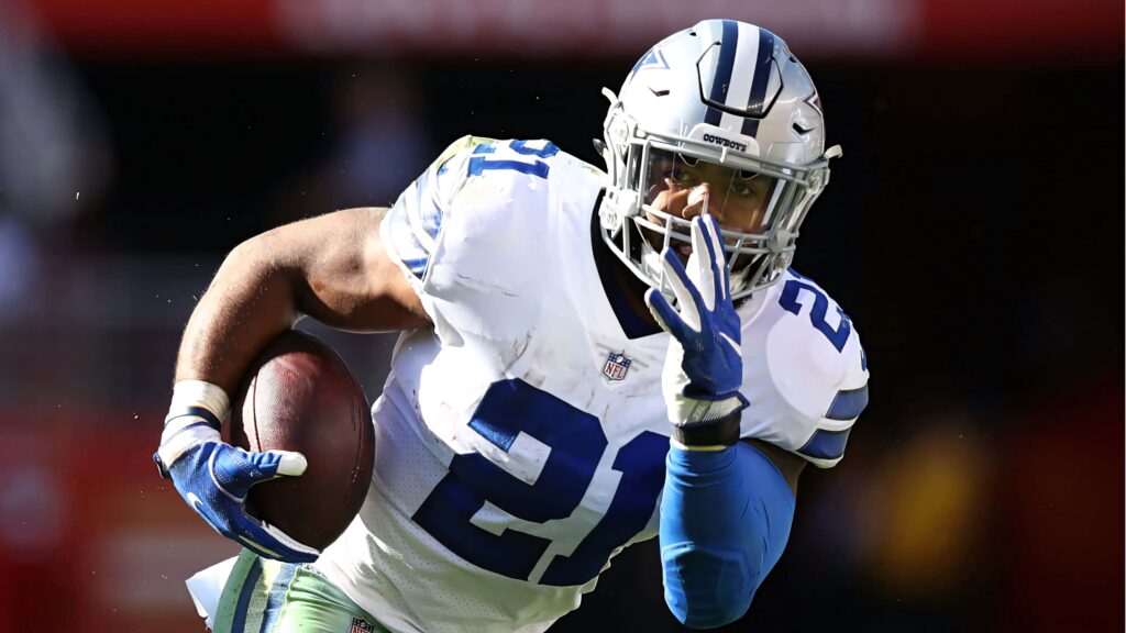 Ezekiel Elliott Dallas Cowboys number 21 rushing forward intense focus dynamic football wallpaper