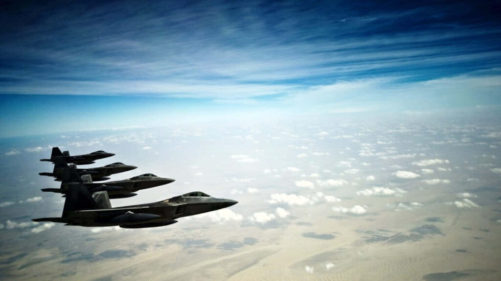Dynamic Formation: F-22 Raptors Paint the Sky Above Jumbo Jets Wallpaper