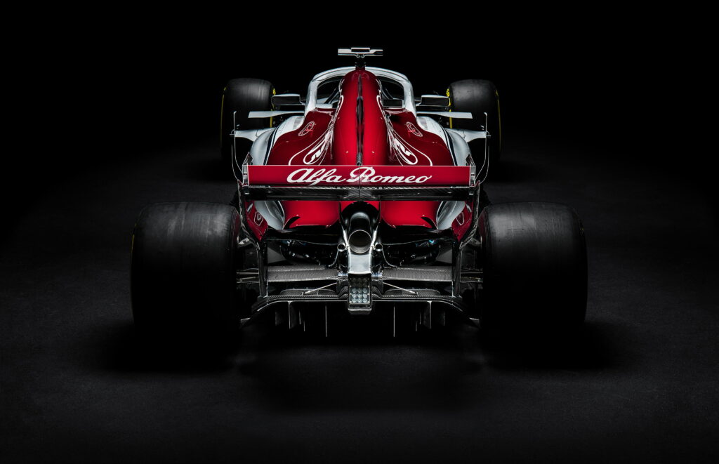 2018 Alfa Romeo Sauber C37 F1 car rear view in studio red white livery 4K wallpaper background