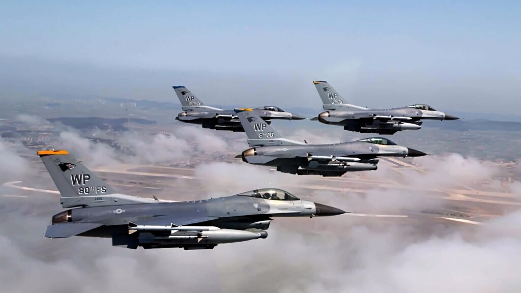 General Dynamics F-16 Fighting Falcon jets flying in formation above clouds clear blue sky wallpaper
