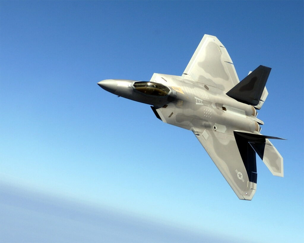 In the Skies: HD Artistic Depiction of F-22 Raptor, the Majestic Military Aircraft Wallpaper