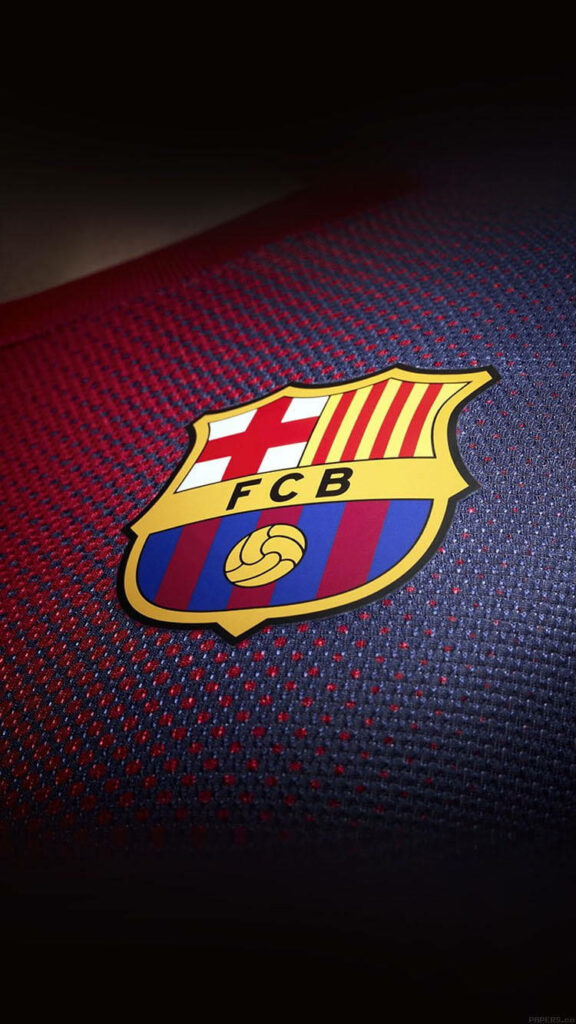 Close-up of FC Barcelona logo on classic textured jersey background for passionate fans wallpaper