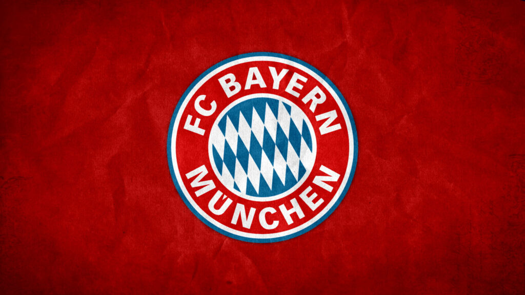 FC Bayern Munich logo on textured red paper background highlighting Bavarian emblem colors Wallpaper