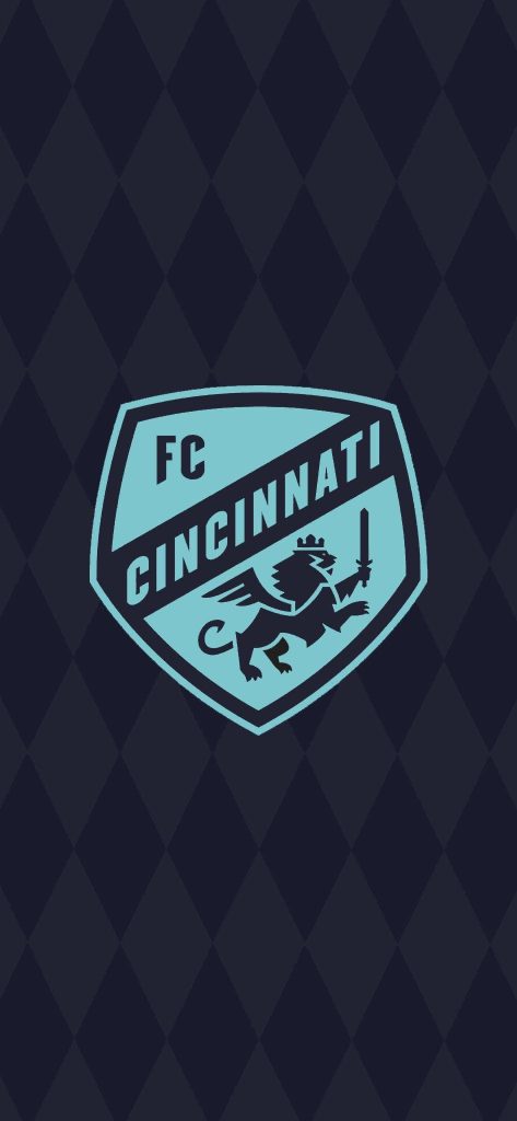 FC Cincinnati wallpaper with light blue winged lion crest on dark navy diamond background