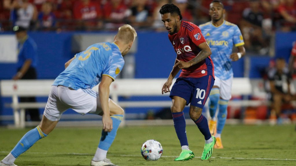 Jesús Ferreira dribbling past Philadelphia Union defender in intense Major League Soccer action wallpaper
