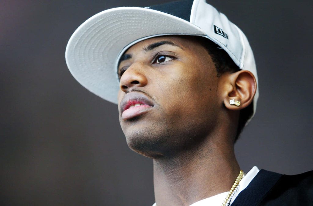 Close-up portrait of rapper Fabolous wearing New Era cap diamond earring and gold chain Wallpaper
