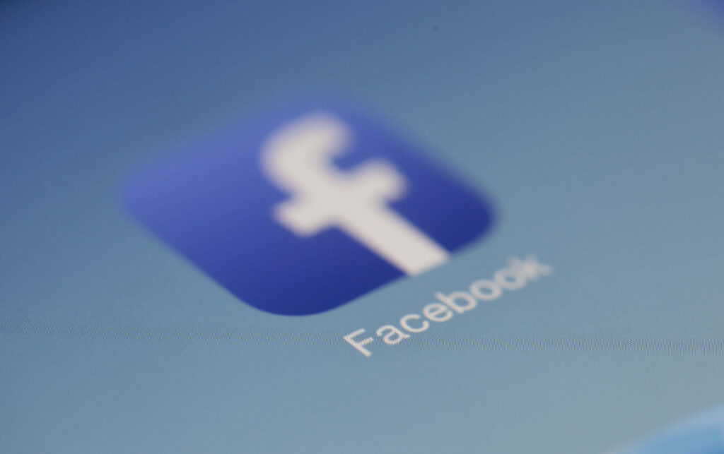 Facebook logo on smooth blue gradient background minimalist social media branding wallpaper