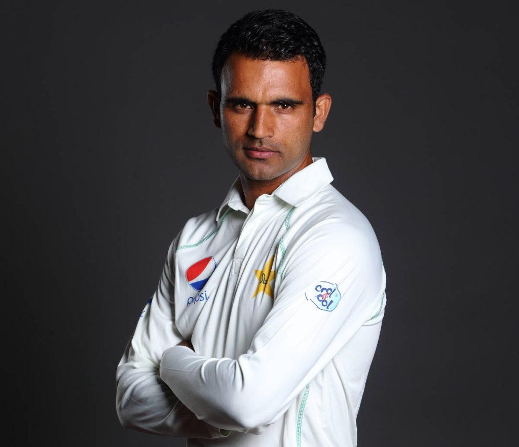 Pakistani cricketer Fakhar Zaman portrait in white Test kit with intense focused expression Wallpaper