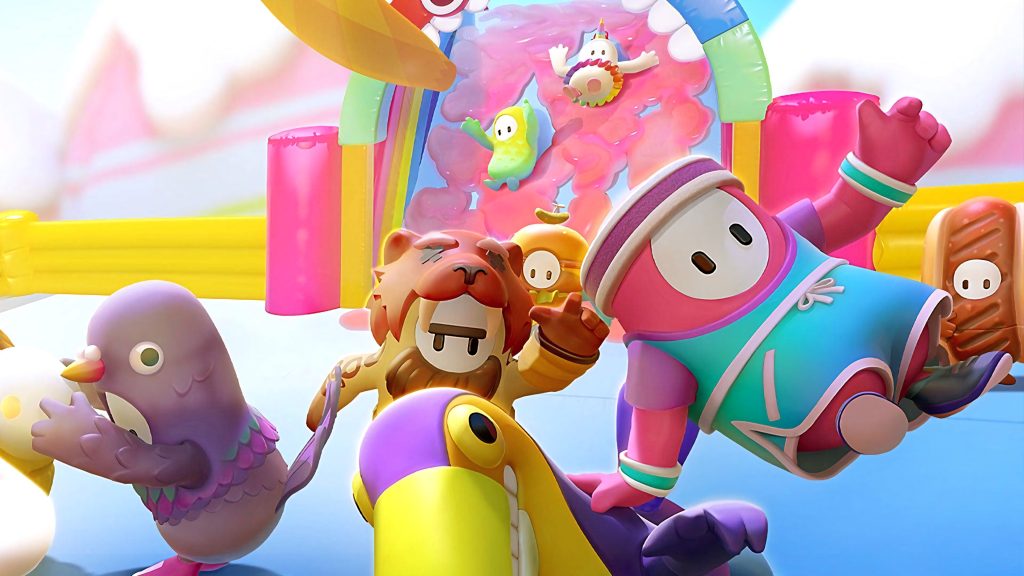 Fall Guys colorful bean characters in costumes racing through vibrant obstacle course wallpaper