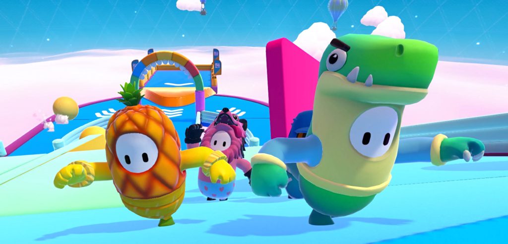 Colorful Fall Guys characters in pineapple raptor and wolf costumes race on blue obstacle course Wallpaper