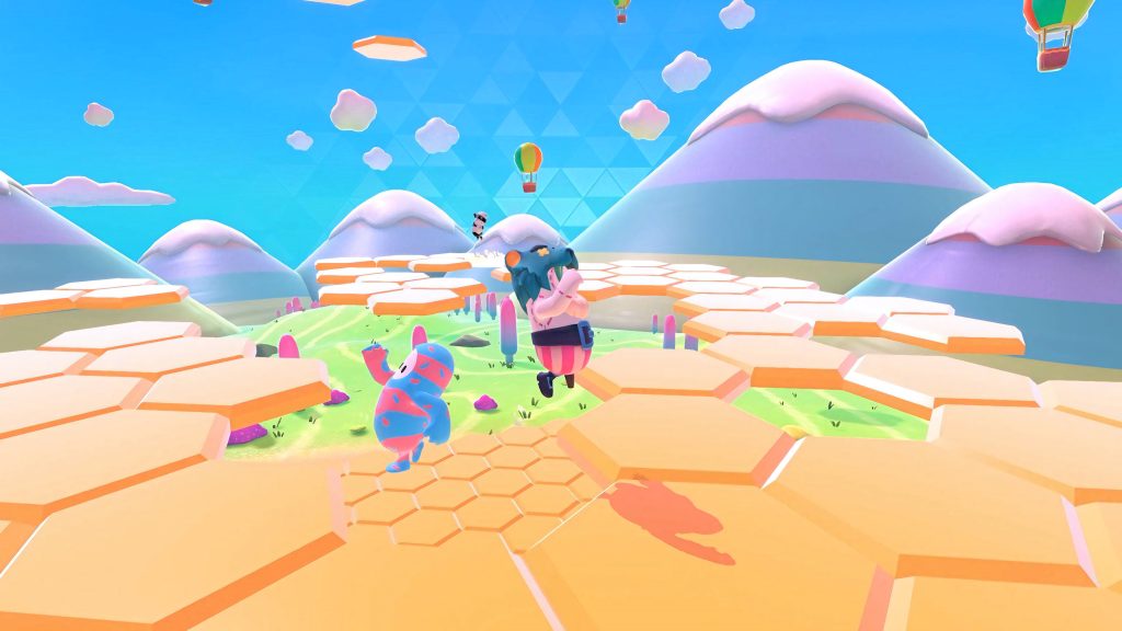 Fall Guys Hex-A-Ring level colorful beans on orange tiles with pastel mountains and balloons background Wallpaper