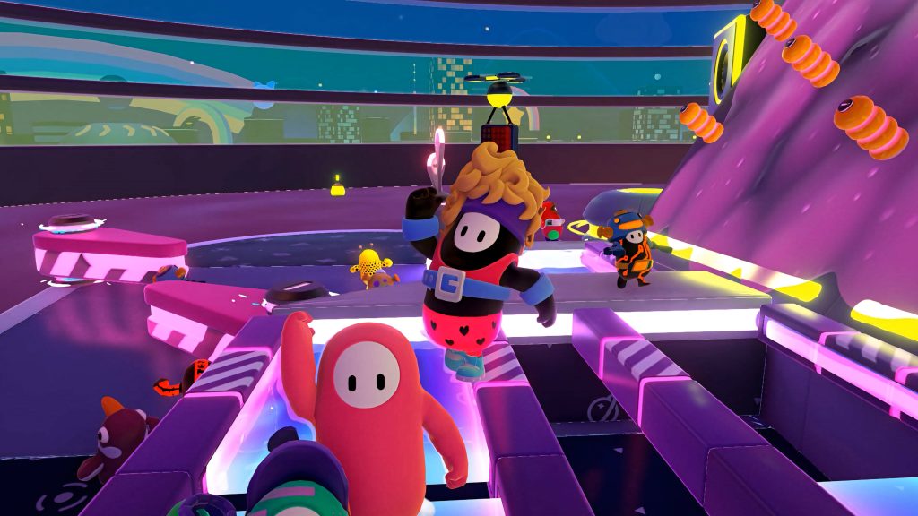 Fall Guys Ultimate Knockout gameplay wallpaper vibrant neon obstacle course with retro 80s costume beans
