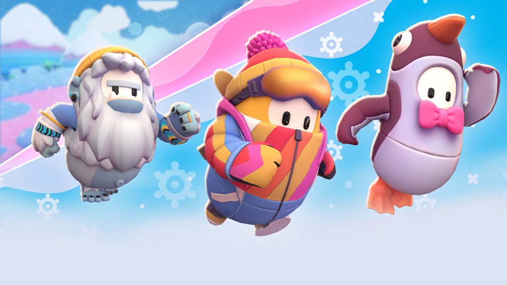 Fall Guys winter wallpaper with three colorful beans in yeti skier and penguin costumes racing