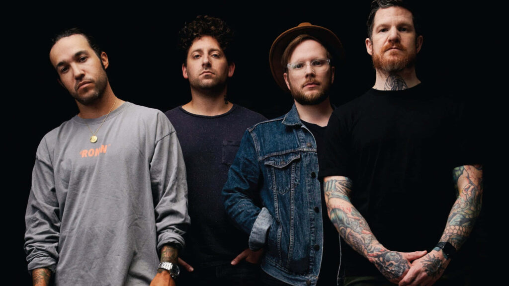 Fall Out Boy band members standing together dark background rock style wallpaper fans