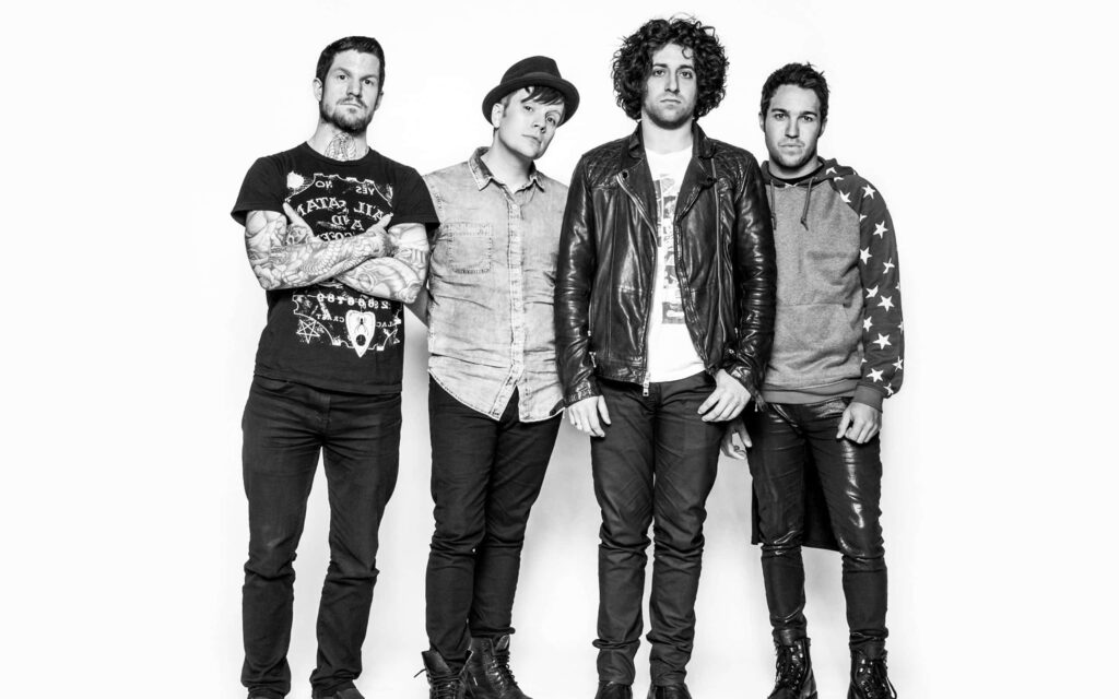 Fall Out Boy black and white band portrait wallpaper capturing energetic iconic rock members