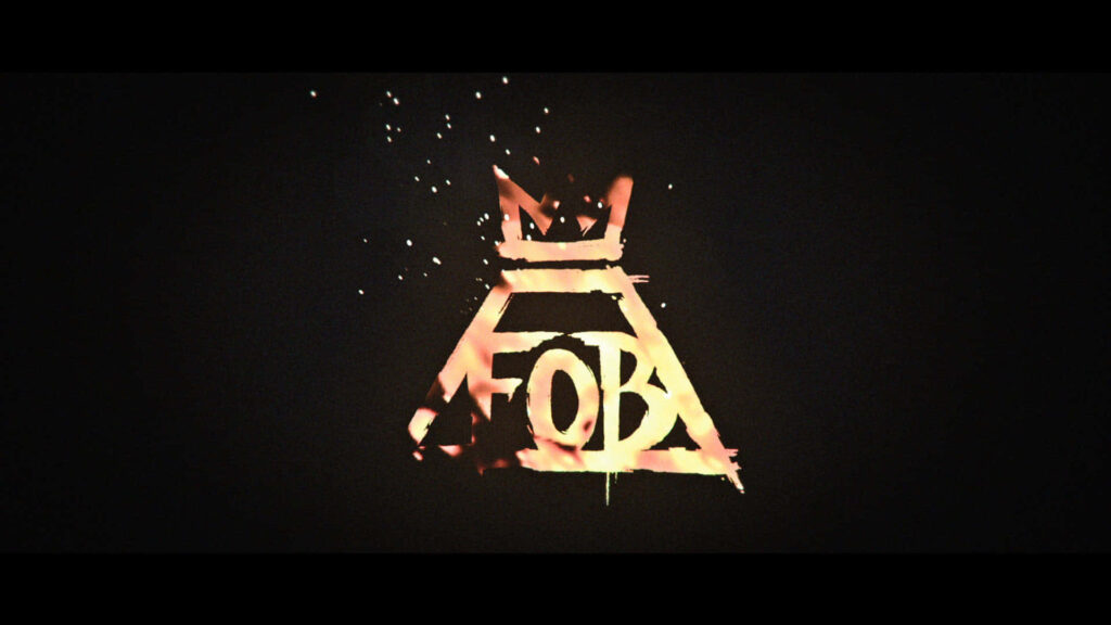 Fall Out Boy logo wallpaper with fiery effects symbolizing band’s powerful energetic return