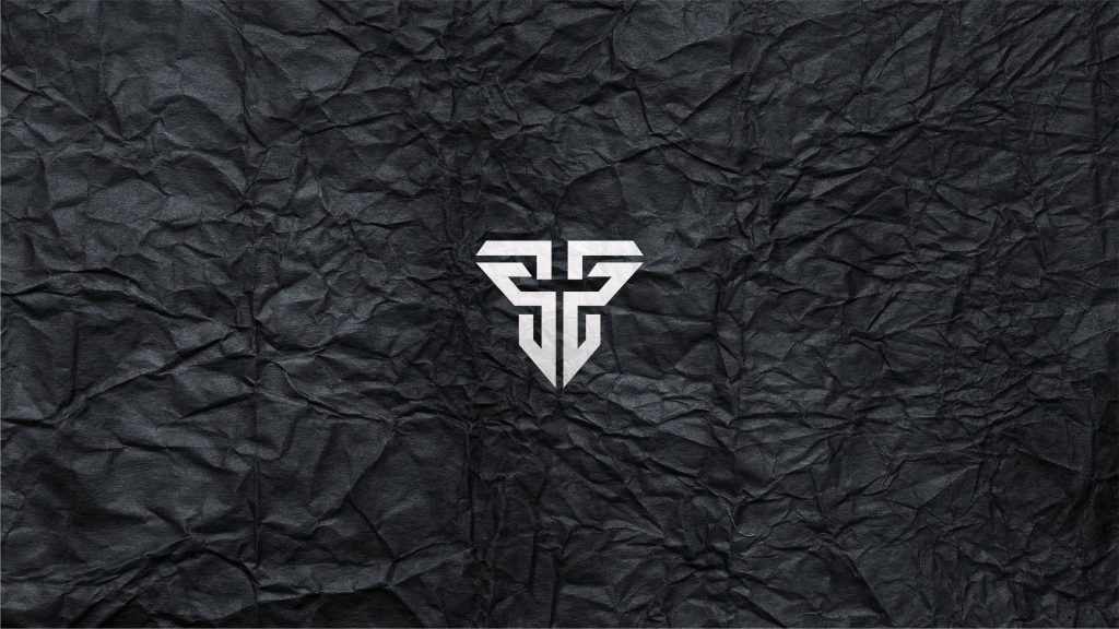 High-contrast Fallen Footwear logo on textured black crumpled paper wallpaper background