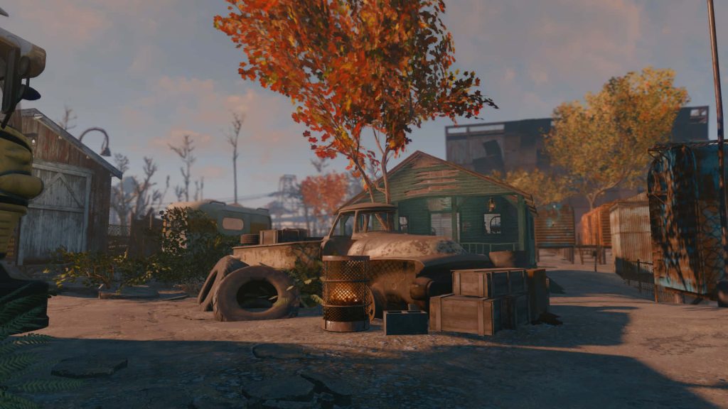 Fallout 4 wallpaper with rusted truck green shed fire barrel autumn leaves post-apocalyptic scene