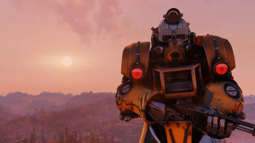Fallout 76 CGI wallpaper rugged yellow Excavator Power Armor with rifle overlooking forest valley at sunset