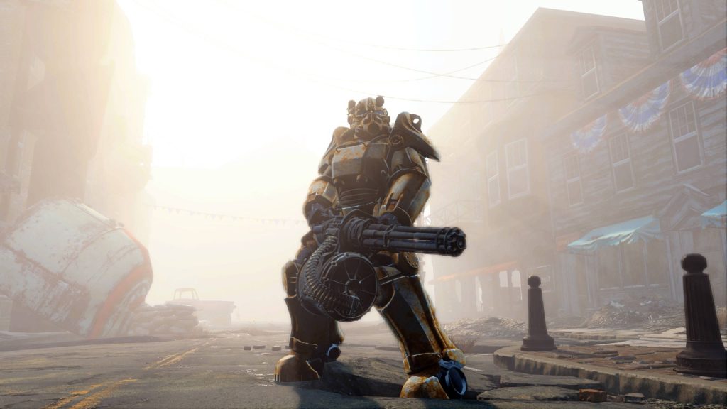 Survivor in rusted Power Armor with minigun in sunlit desolate Fallout 76 post-apocalyptic town Wallpaper