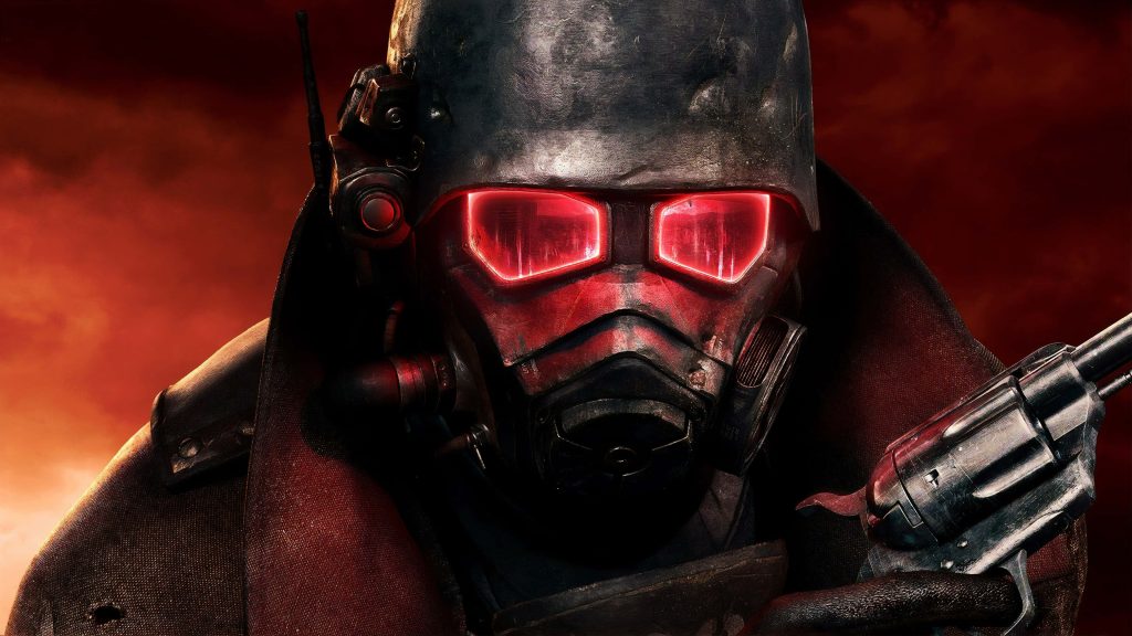 Close-up of NCR Veteran Ranger helmet with glowing red lenses and revolver Fallout New Vegas Wallpaper